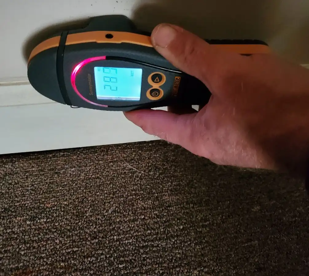 Moisture detection at baseboard during Storm Damage Restoration in Nashville